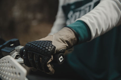closeup of gloves on throttle