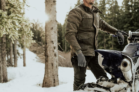 man standing with bike