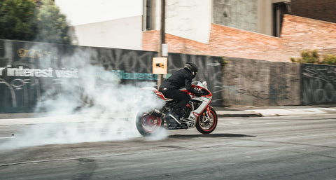 motorcycle-skidding-on-road