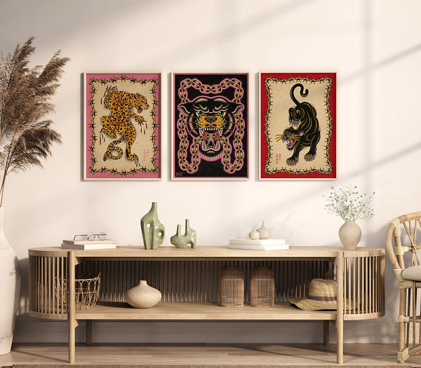 Cream wall with 3 A3 art prints of big wild cats in traditional tattoo style, with a modern twist.