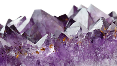 close-up high definition photo of a glimmering purple amethyst geode