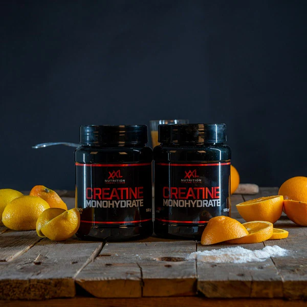 XXL Nutrition creatine supplement orange flavor, promoting enhanced muscle growth and performance