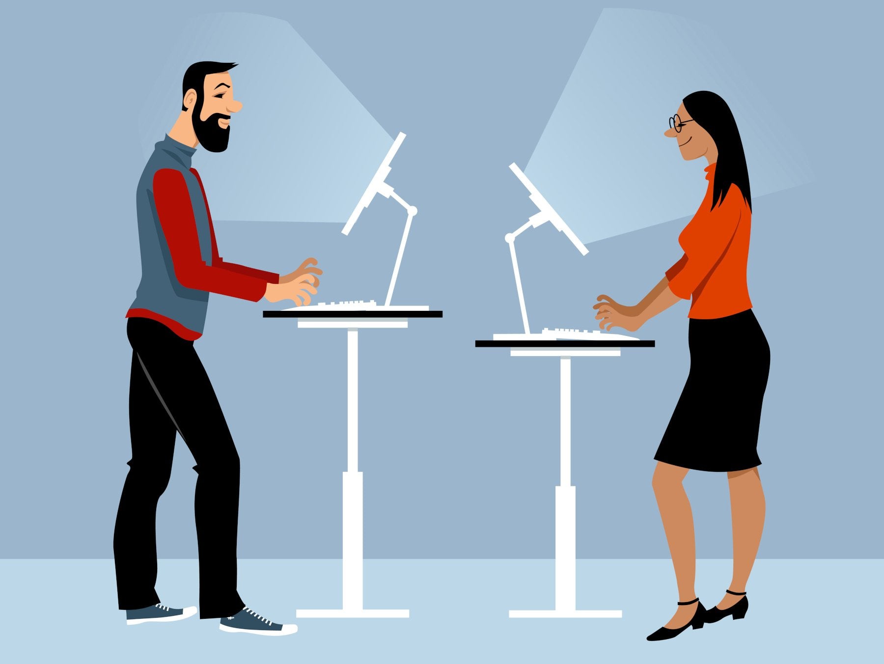 A man and woman are working from standing desks
