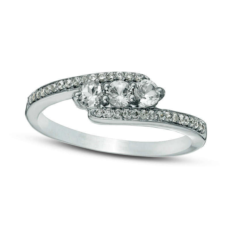 Lab-Created White Sapphire and 0.17 CT. T.W. Diamond Three Stone Bypass Ring in Sterling Silver