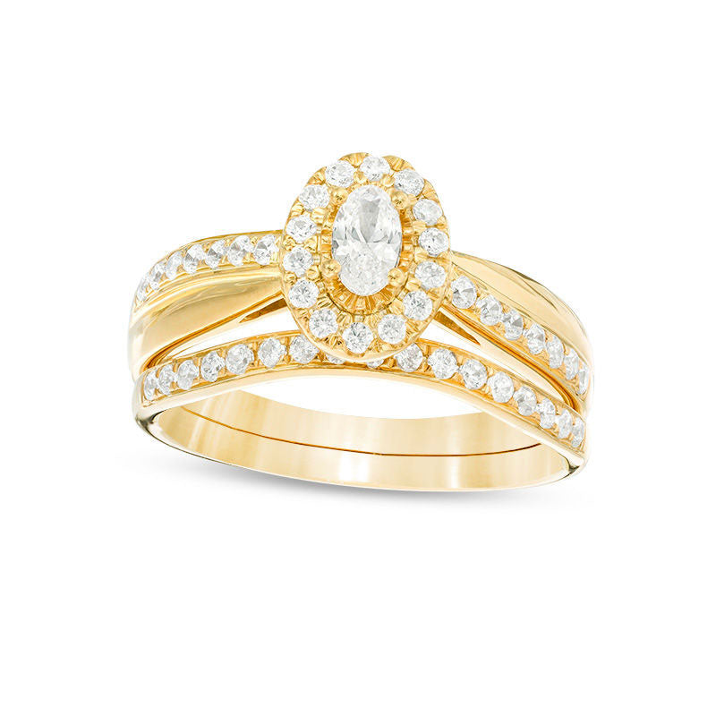 0.75 CT. T.W. Oval Natural Diamond Frame Crossover Bridal Engagement Ring Set in Solid 14K Gold