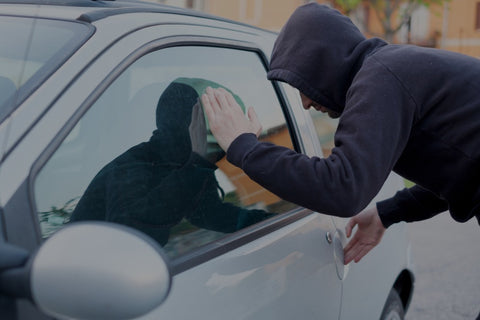 man thinking of breaking into car