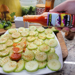 Hot sauce over sliced cucumbers as a snack