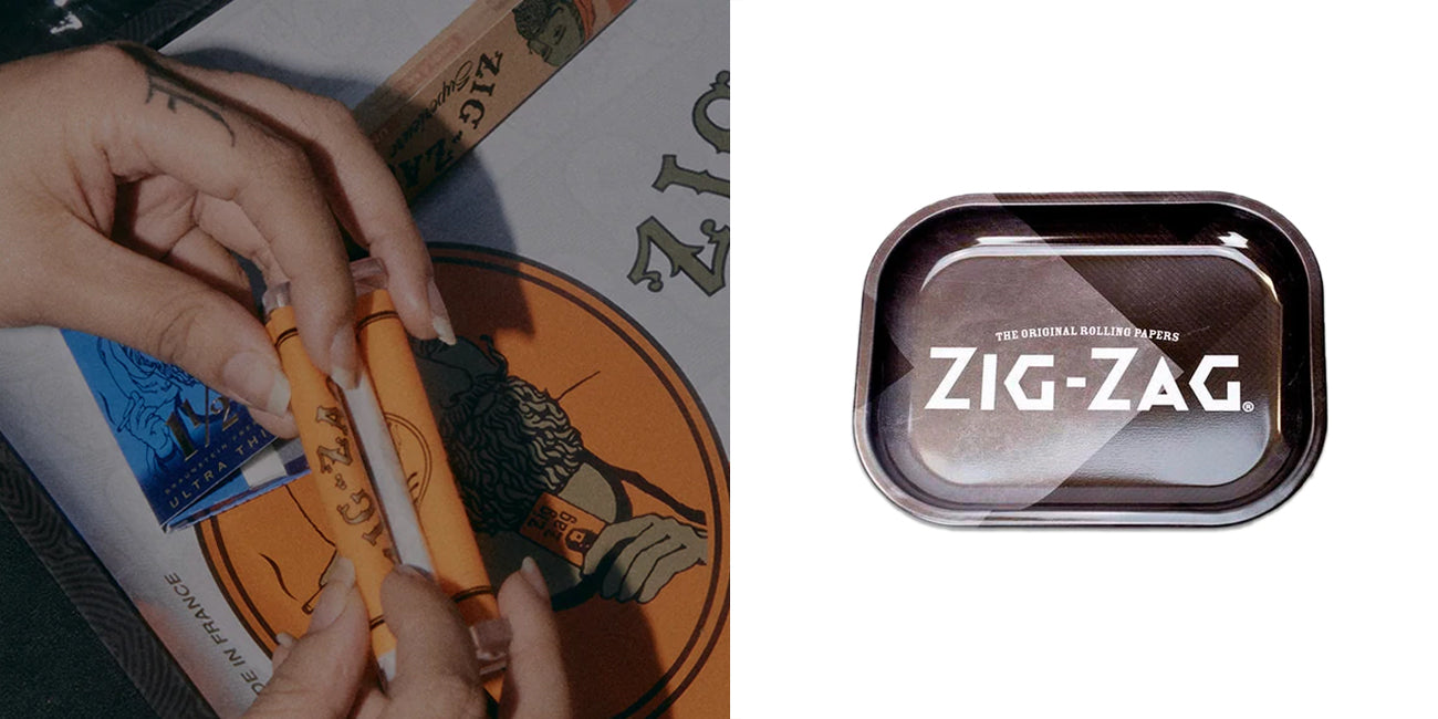 Zig-Zag Metal Rolling Tray Black Small Medium with Zig-Zag Orange Rolling Papers rolling on a tray