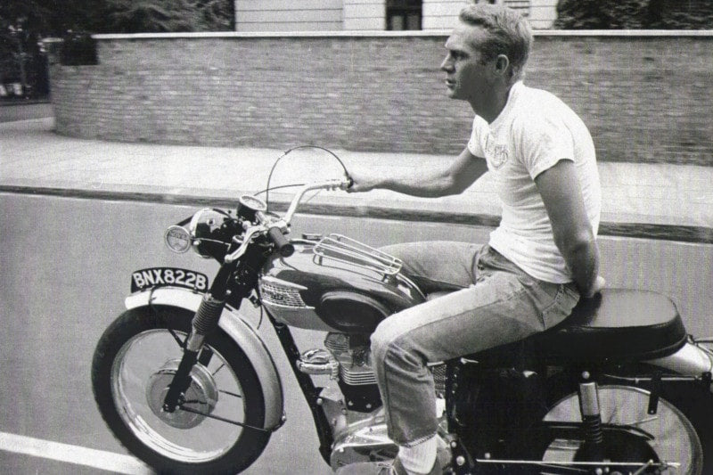 What is more stylish than STEVE MCQUEEN riding this Triumph motorcycle one handed?