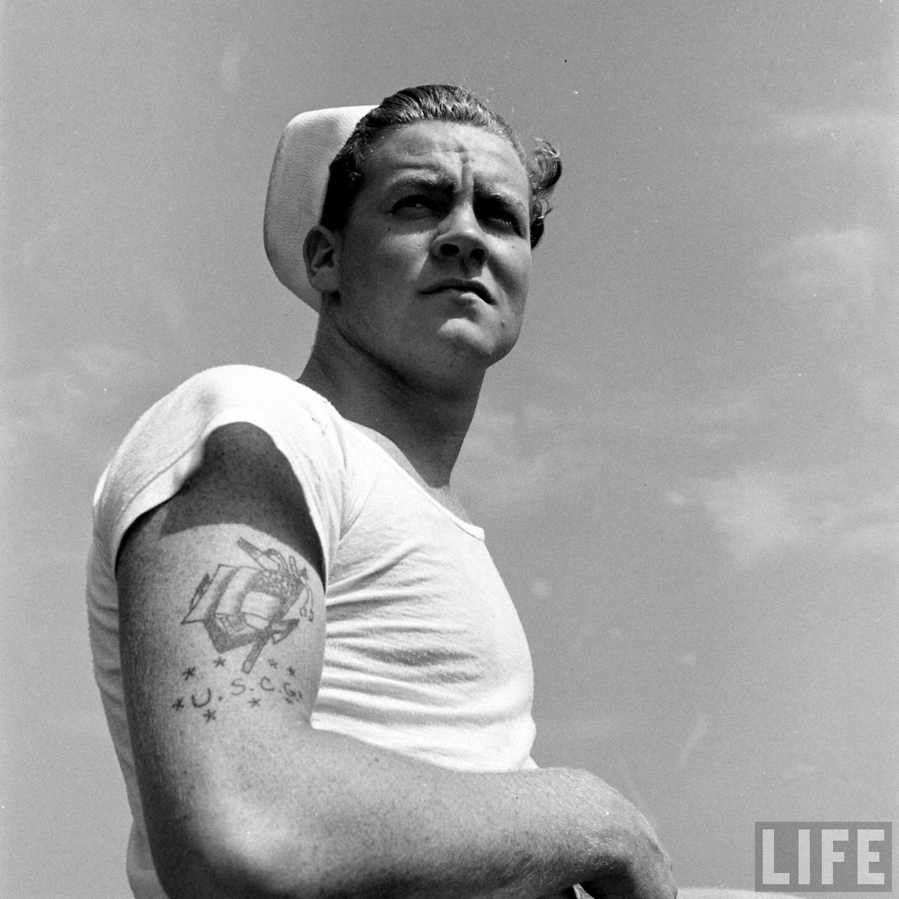 An iconic photo of a US Sailor in a white T-shirt. Photo credit and copyright LIFE magazine