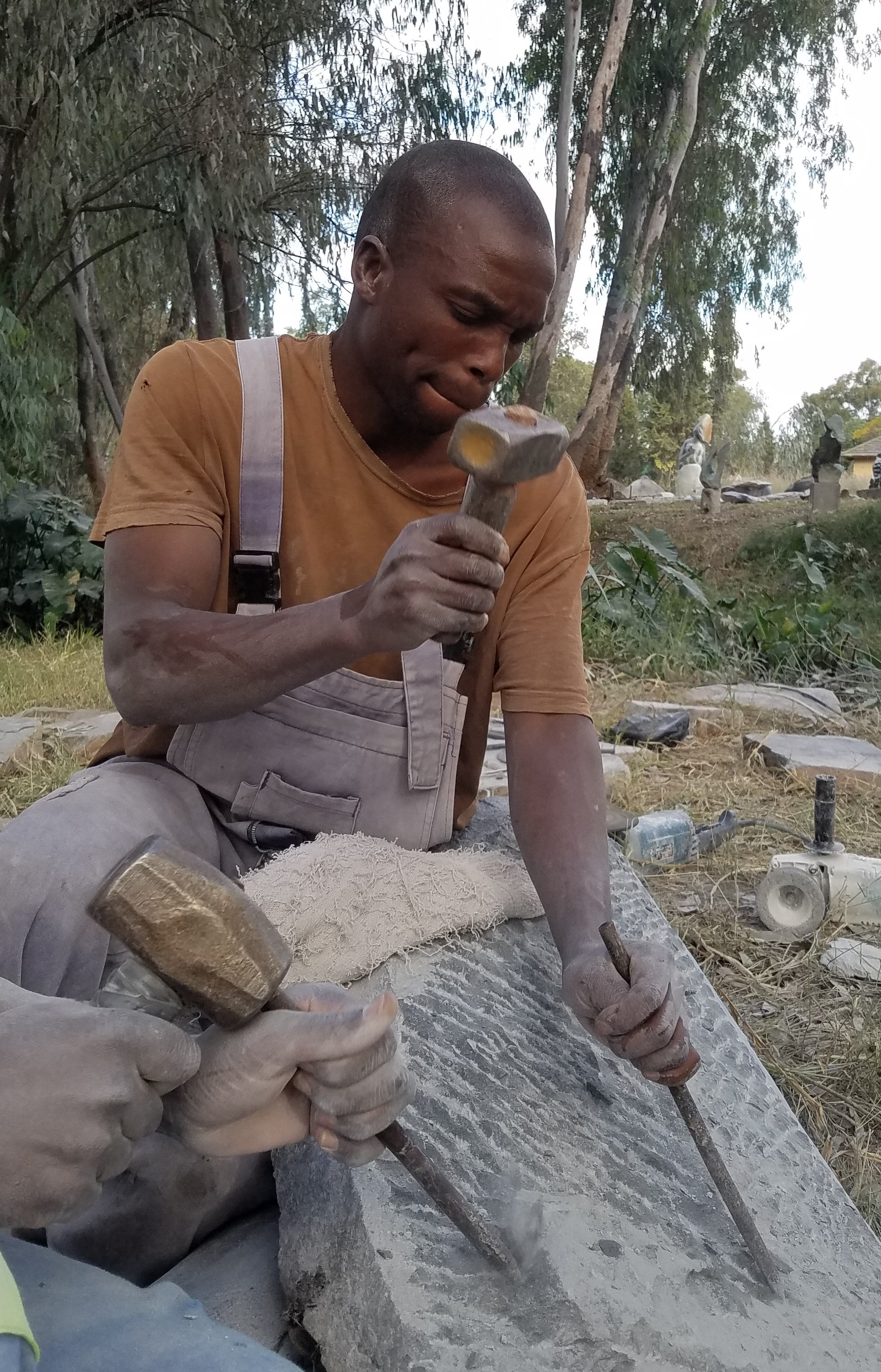 Zimbabwe stone artist at work.