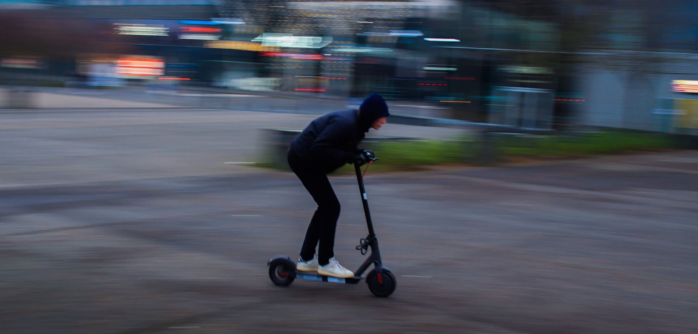 Electric Scooter Rider Going At High Speed Urban Photo