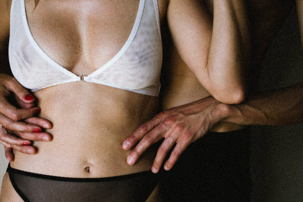 crop photo of couple wearing Kye Intimates