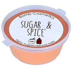 A close-up of a Bomb Cosmetics Sugar and Spice wax melt, a scented wax cube that can be melted in a wax warmer to release a warm and inviting aroma of spices and sweetness into the air.