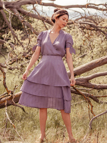 woman wearing purple sustainable skirt