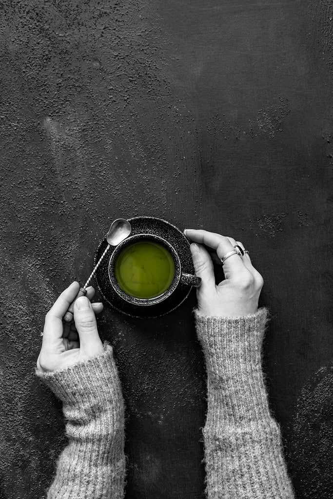 Hands Holding Matcha Tea