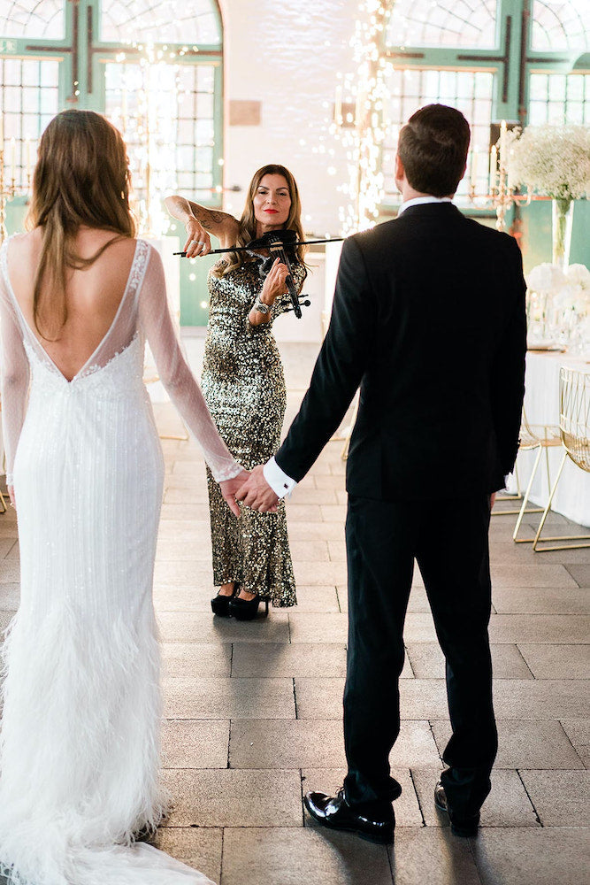 Bride and groom and violinist