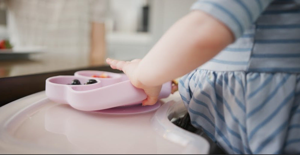 Baby with a pink Octopod suction dish from Abiie
