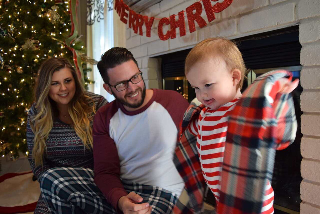 young parents with baby at Christmas