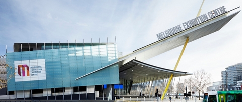 Melbourne Convention and Exhibition Centre Outdoor. Glass and Steel building with a big yellow pole