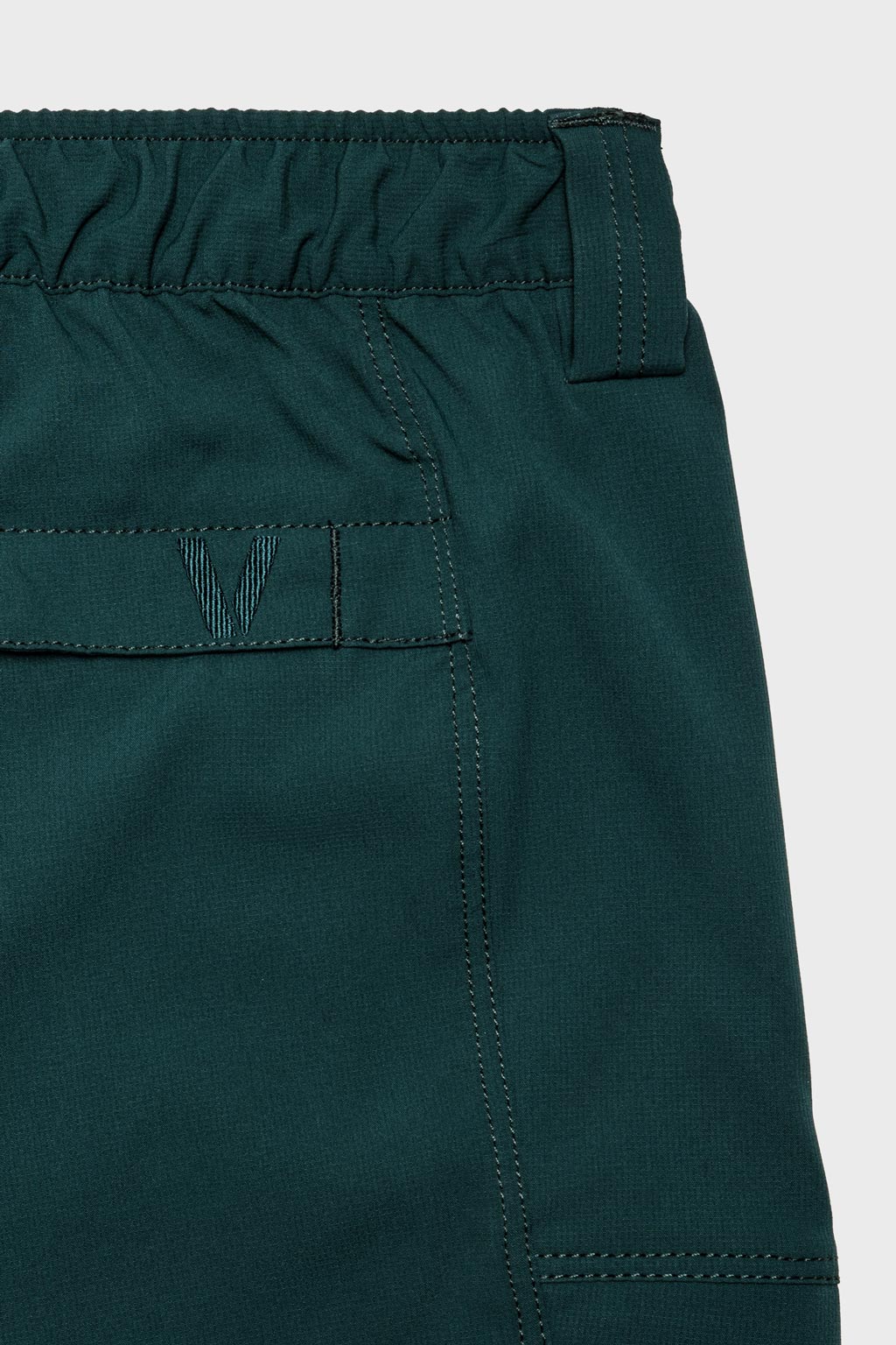 A tonal embroidered logo is visible at the back pocket.