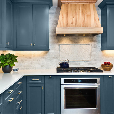 Blue kitchen with white counter top, painted in Colourtrend Paints Juniper Whorl