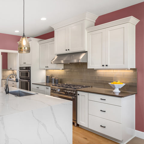Pink kitchen walls with white cabinets, painted in Colourtrend Pink Chocolate and Milk Teeth