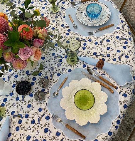 blue and white table cloth with white plates
