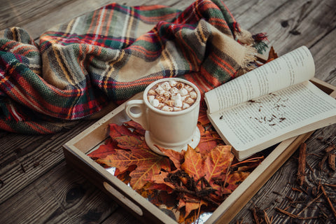 a cup of coffee with fall vibes