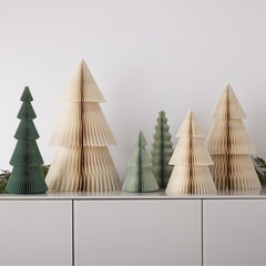 Six accordion style Christmas trees; three are green and three are beige. 