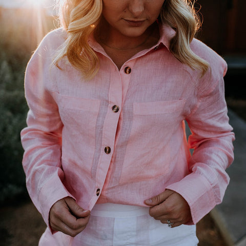 pink organic linen shirt worn by blonde woman