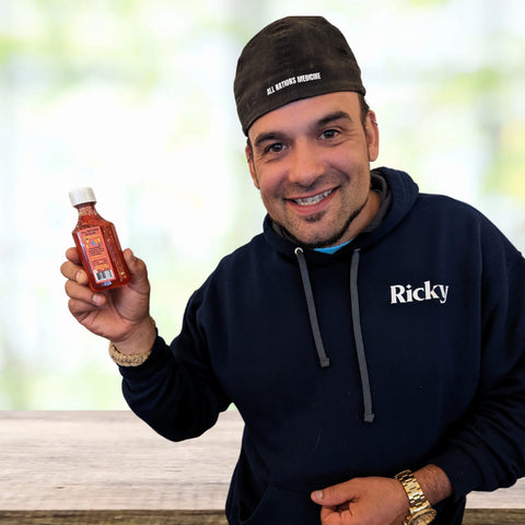 Ricky taff holding his cbd syrup