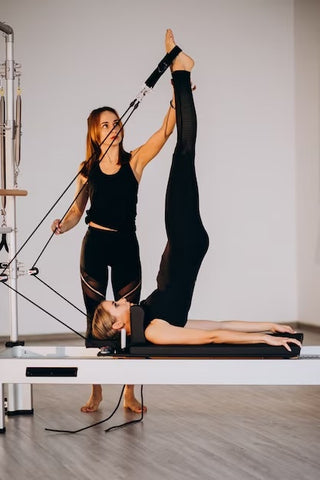 Women on pilates machine