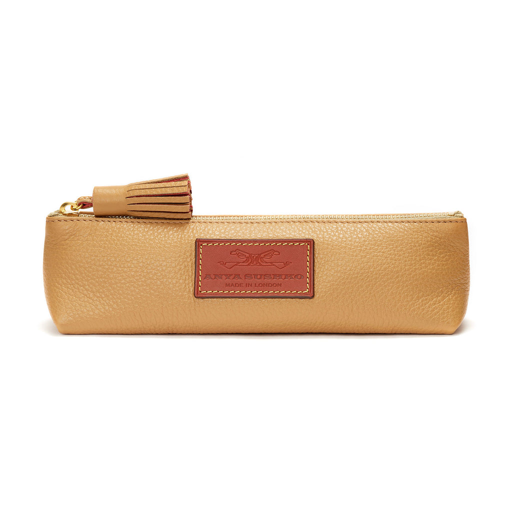 https://cdn.shopify.com/s/files/1/0441/9477/products/anya-sushko-pencil-case-in-textured-tan-cowhide-with-tassel-front_1024x1024.jpg?v=1634154118