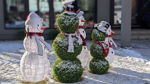 Christmas snowmen made with artificial topiaries