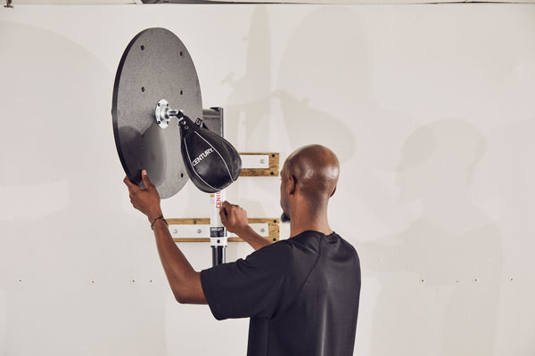 man installing speed bag