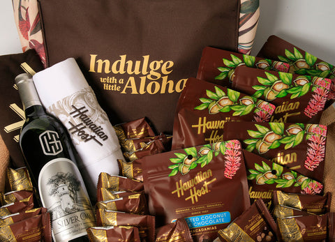 Hawaiian Host Indulge with a little Aloha tote bag with Paradise Collection and Founder's Collection chocolates, Hawaiian Host x UNIQLO t-shirts and wine bottle