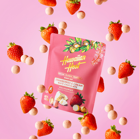 Hawaiian Host Paradise Collection Strawberries & Cream White Chocolate Macadamias on pretty pink background with strawberries and product falling int he background