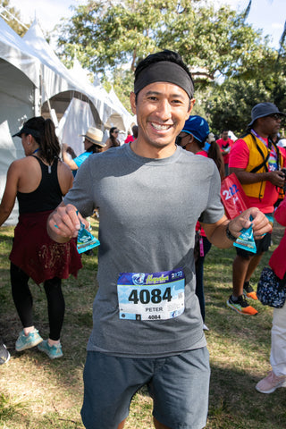 Hapalua participant at Mauna Loa's tent at the Hapalua Finishers Festival