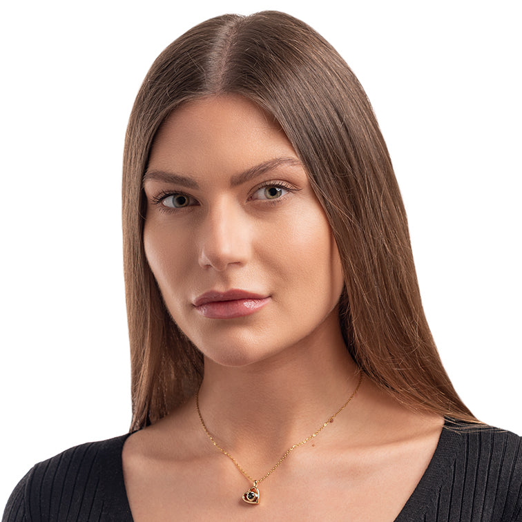 Woman wearing a heart projection necklace