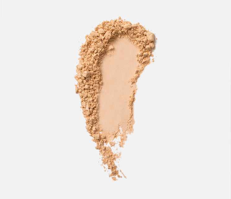 Compact of finishing powder in yellow beige hue