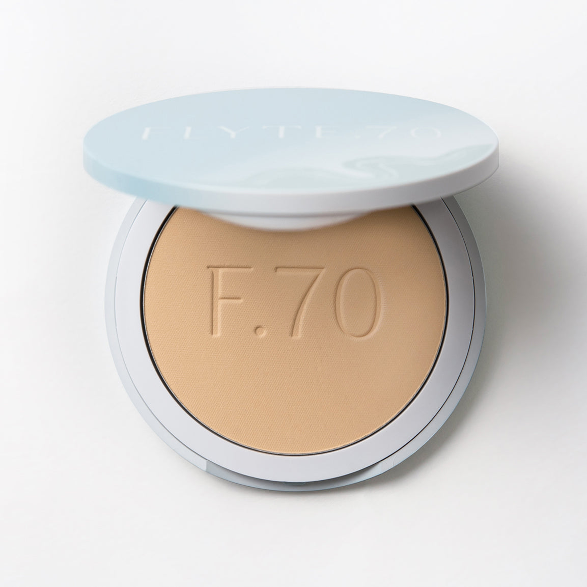 Compact of finishing powder in yellow beige hue