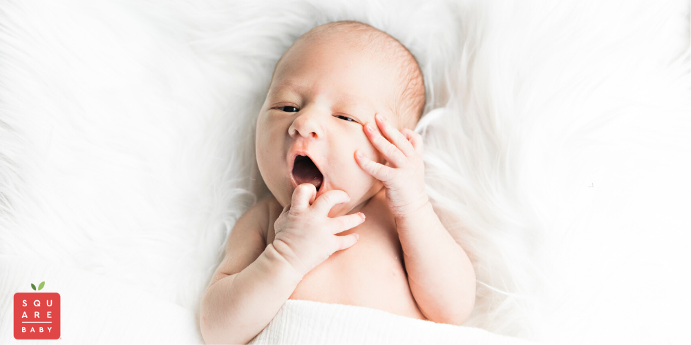 tired baby - baby eating hands - square baby - baby eczema