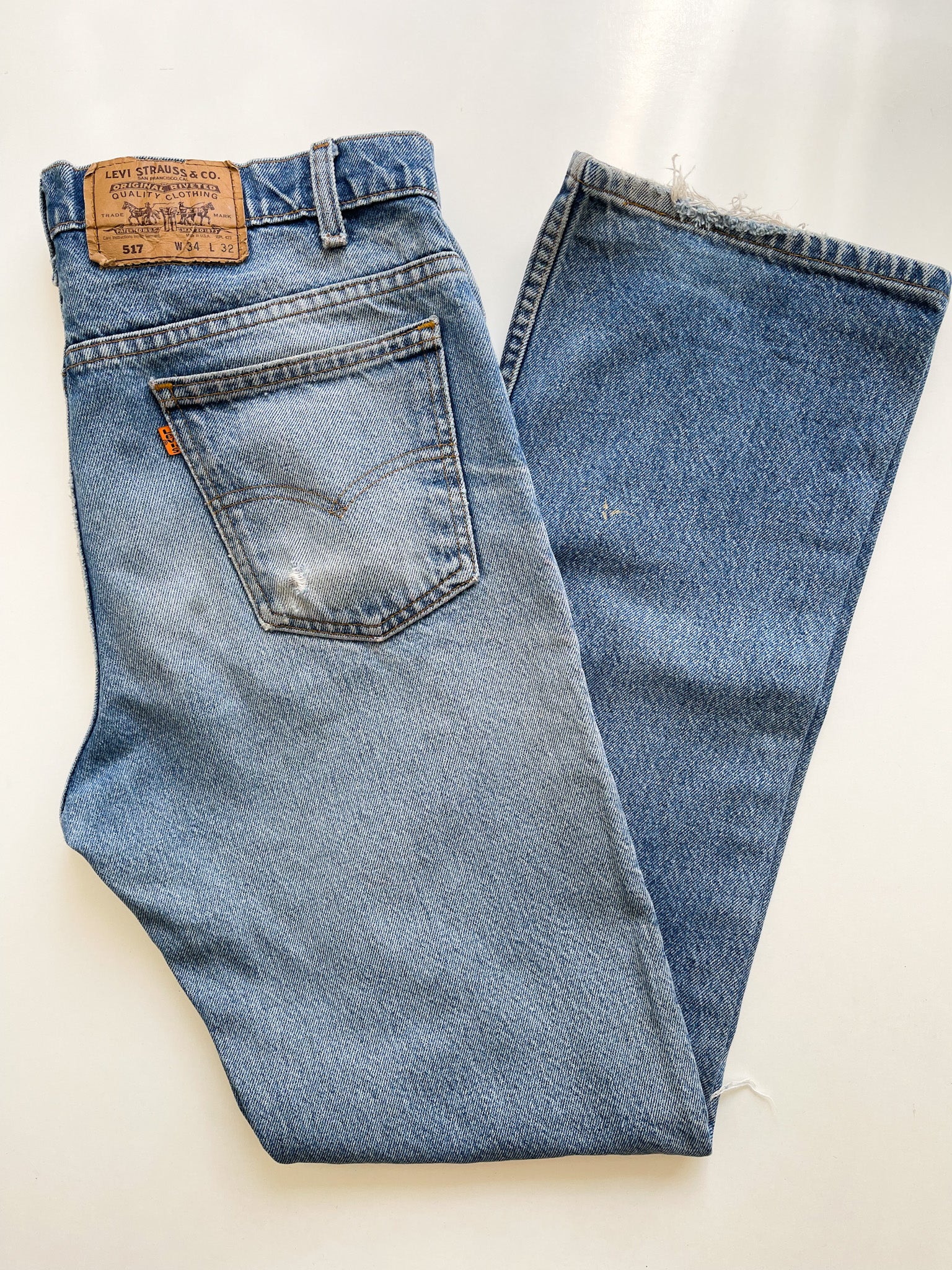 Vintage Levi's 517 Orange Tab Jeans with Distressed Knees - 33