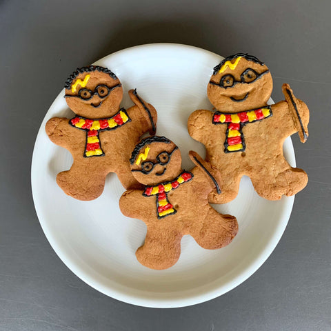 Three gingerbread men decorated to look like Harry Potter for World Book Day