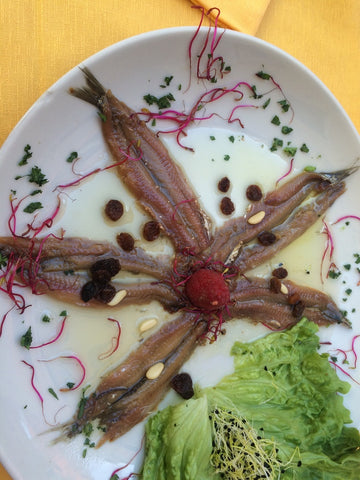 Anchovies with pine nuts and raisins.