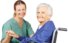 nurse holding hands with elderly woman in wheelchair, smiling