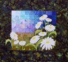 A Freshness of Spring - quilt pattern by Ruth Blanchet of applique diasies and patchwork background of mountains