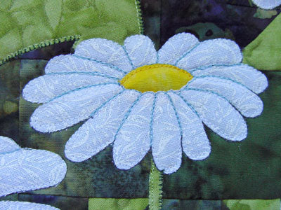 thread color enhances the daisy outline