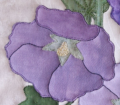 close up of stitching on hollyhock flower
